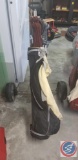 Coyote golf bag on Nomad caddy with (13) assorted golf clubs and golf balls