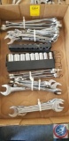 Flat containing assorted wrenches and sockets