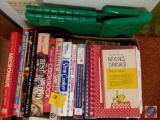 Box of assorted cookbooks