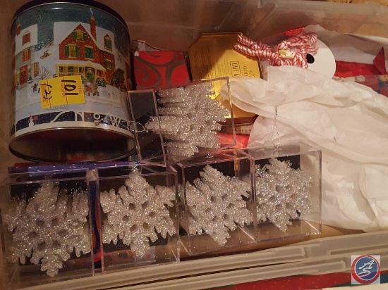 (2) plastic totes with lids containing assorted Christmas gift wrap and assorted decorations