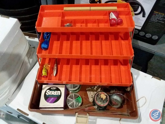 Trophy tackle box with assorted fishing line, lures and more