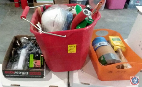 Bucket containing assorted painters tools including; paint rollers, brushes, face masks, rubber