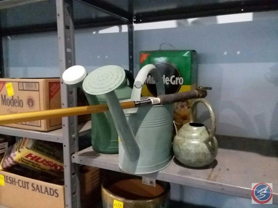 (3) watering cans, box of Miracle-Gro all purpose plant food, long handled tool
