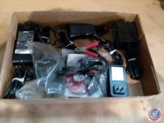 Flat containing a small set of jumper cables, assorted cords and more