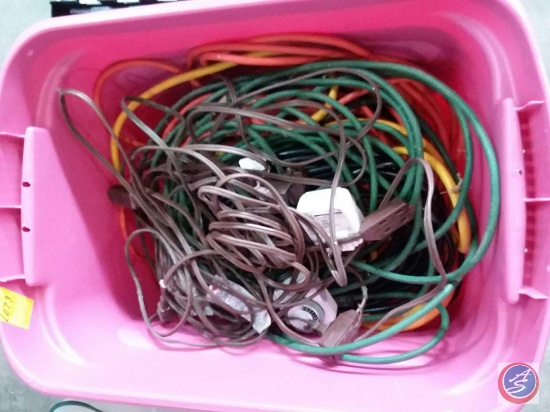 Storage tote containing assorted extension cords