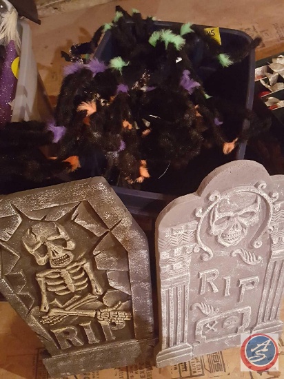 Tote containing assorted Halloween decorations including Styrofoam tombstones