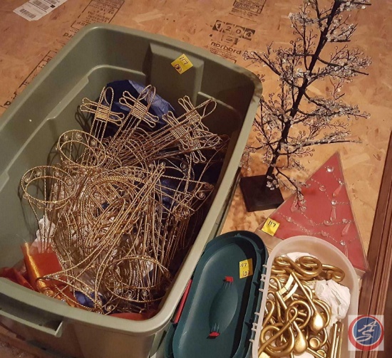 Large bin containing decorative metal musical instruments, Pottery Barn chandelier glass garland