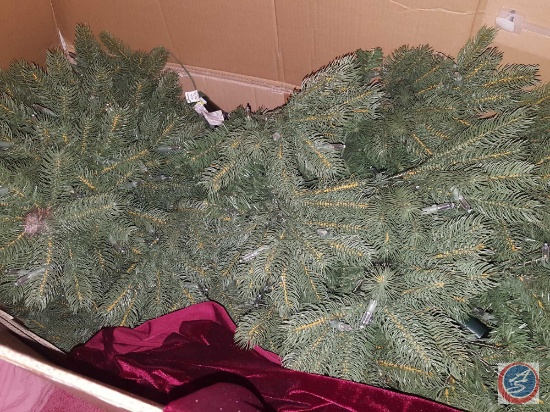 GE Just Cut Evergreen 9' pre-lit LED Christmas tree and red velvet cloth