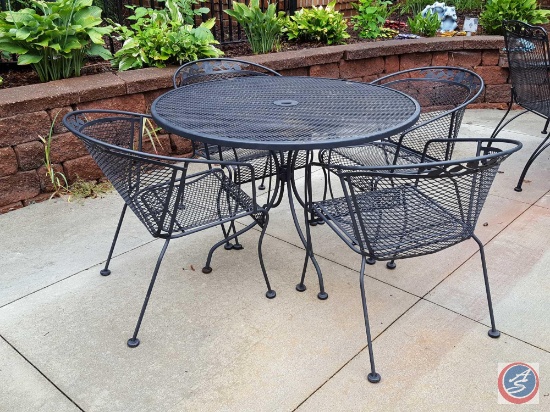 5 pc. Wrought iron patio set: round table and (4) chairs