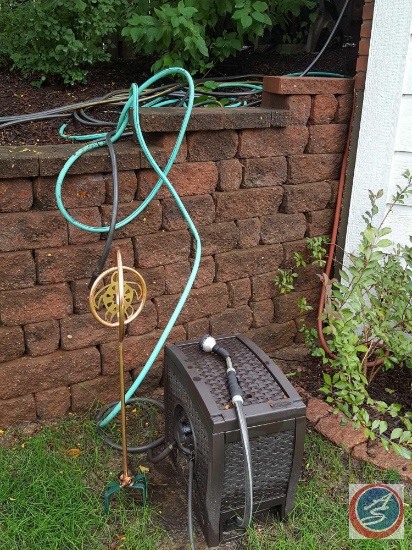Suncast resin garden hose storage container, (3) hoses, hose reel caddy, nozzles, and a decorative