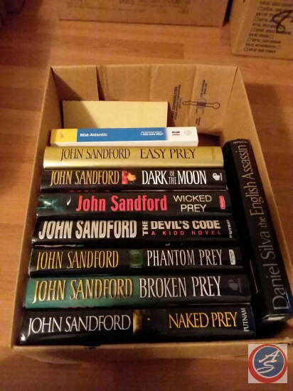 (10) books including authors John Sandford and Daniel Silva
