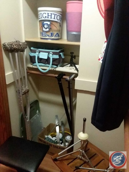 Contents of closet to include; aluminum crutches, (4) walking canes, bath chair with teak seat,
