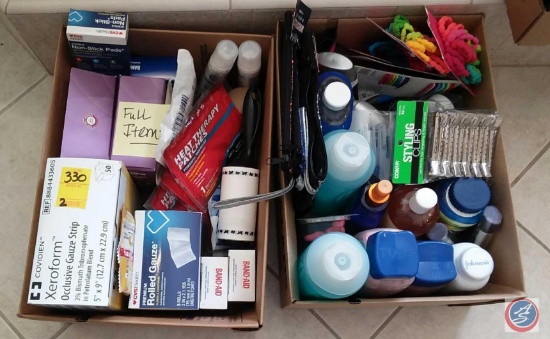 (2) boxes containing band-aids, rolled gauze, lint brushes, Heat Therapy patches, Rogaine, Suave