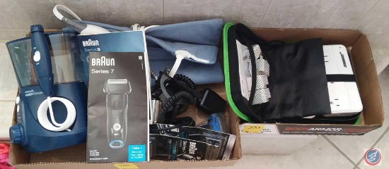 (2) flats containing Braun series 3 and series 7 electric razors with replacement blades, Waterpik