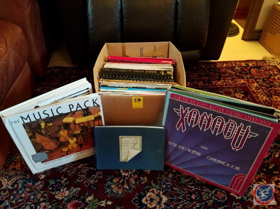 Box containing assorted musical instruction guides, assorted records (33's)