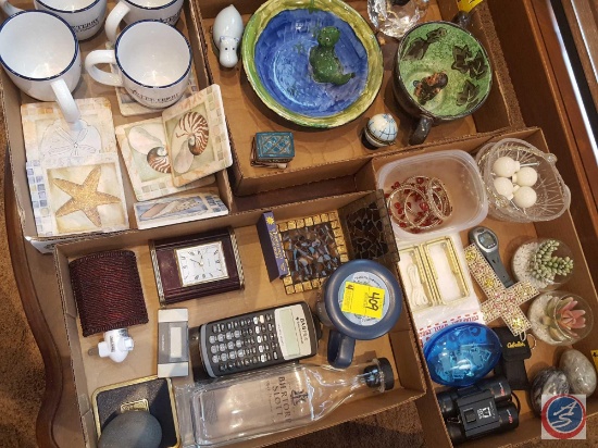 (4) flats containing; coffee mugs, decorative figurines, coasters, desk clock, calculator, field