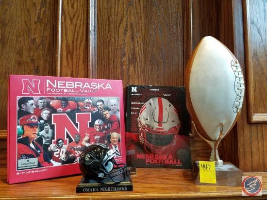 Wilson Husker autographed football with display stand, Nebraska football vault book, 2017 media