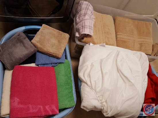(2) laundry baskets and a tote full of assorted linens (towels, tablecloths, mattress pad)