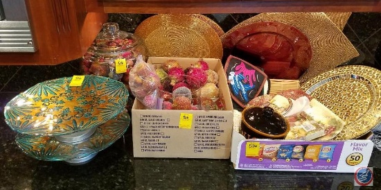 (2) cake plates, beaded placemats, decorative fruit, Wicked Good ceramic jar, hot pads, wine and