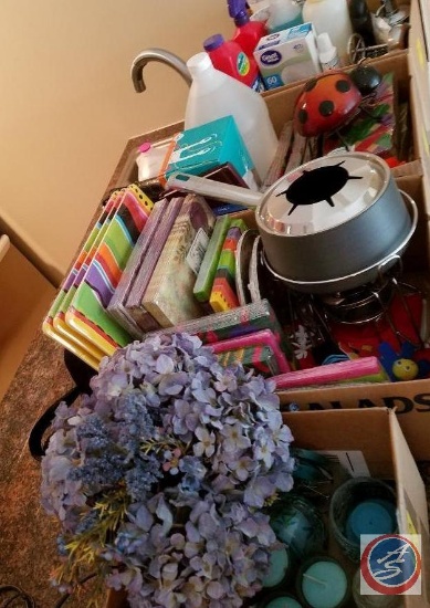 (5) boxes containing; candles, cleaning supplies, home decor, lighting, paper plates and napkins,