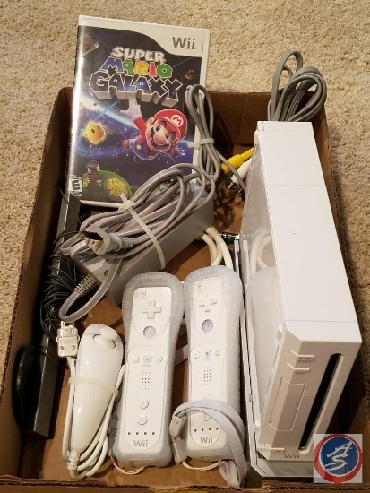 Wii gaming console (model #RVL-001) with stand, (2) controllers, nun-chuck and Super Mario Galaxy