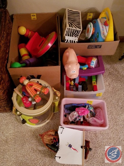 Assorted children's toys including; toy musical instruments, water canons, wood train, jump rope,