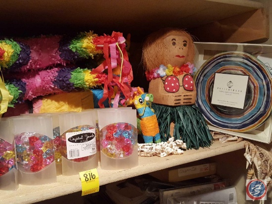 Assorted paper and plastic table ware, pinatas, party lanterns, seashells, fiesta party supplies,