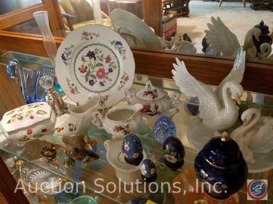 Contents of shelf: Glass swan, decoritive glass eggs on displays, glass geese marked George Good