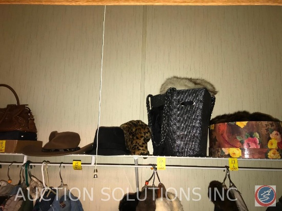 Hat box containing faux fur hats, flat with purses and more. Please note that the doll and stuffed