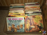 Box of 45 records in paper sleeves, including The Beach Boys, Dungaree Doll, and MUCH more!