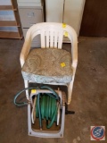 (2) plastic chairs and hose reeler with hose