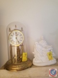 Welby standard gold dial clock, religious figure
