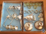 (2) Flats containing assorted silver plated candlestick holders, napkin rings and pitcher
