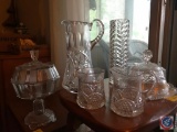 (2) Flats containing; a crystal pitcher, a crystal vase and assorted glass dishes