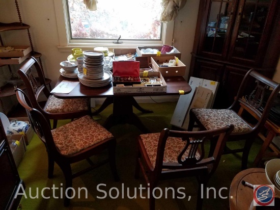 Table measuring 24"X42" with (2) 15" Drop Extensions and 4 Chairs with Floral Embroidered Cushions.