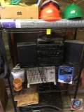Contents of shelf, hard hats, rubber gloves, stereo, space heater, automobile floor mats