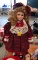 Doll on a Stand Dressed in Holiday Attire