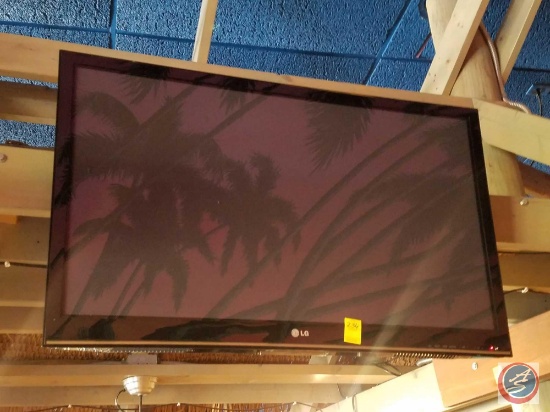 LG 42" Television {{MODEL NUMBER IS NOT VISIBLE DUE TO THE MOUNTING BRACKET. BUYER MUST BRING LADDER