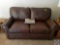 Distinctions Leather Love Seat with Nail Head Accents