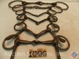 (3) pairs of bits, 6 in. cheek jointed Snaffle - 6 in. half cheek twisted wire Snaffle - 7 and 8 in.