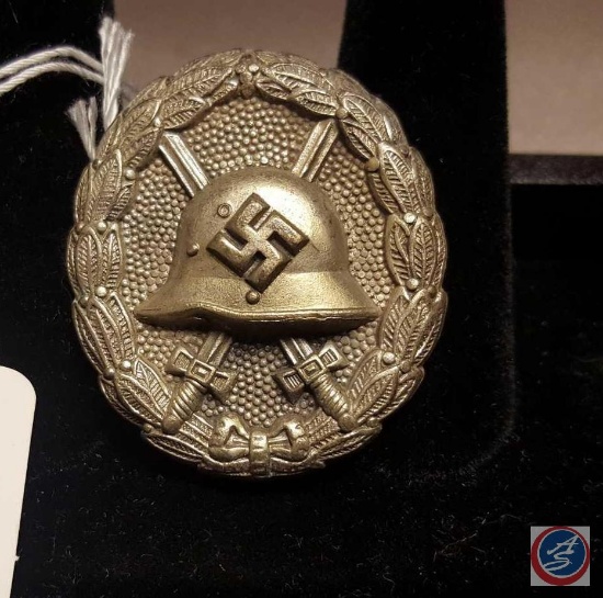 German WWII Waffen SS Bronze Sports Proficiency Badge. Measures 2 in diameter. The front shows a