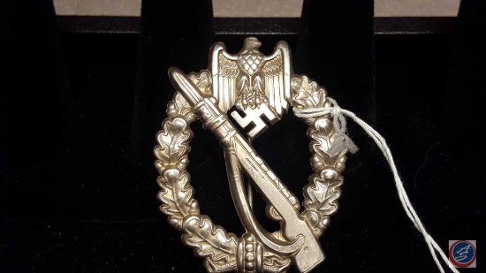 German World War II Army Silver Infantry Assault Badge. The front shows a Mauser rifle in the center
