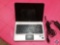 HP Laptop Model No. dm4-1165dx with Windows 7 and Charging Cord