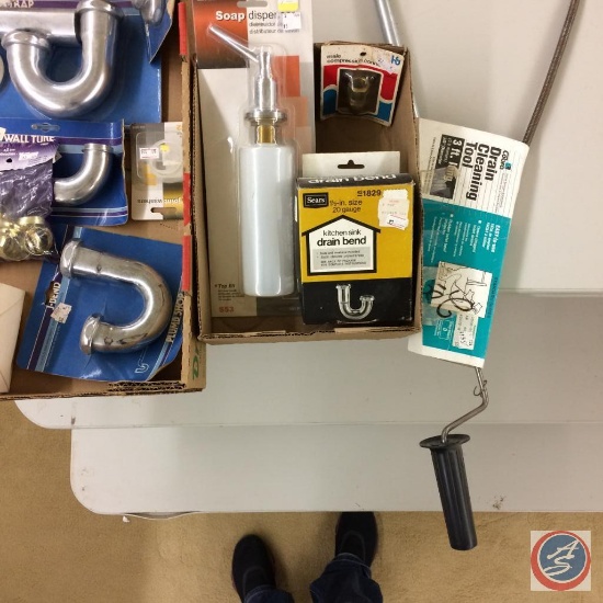 Assorted Plumbing hardware, drain cleaning tool