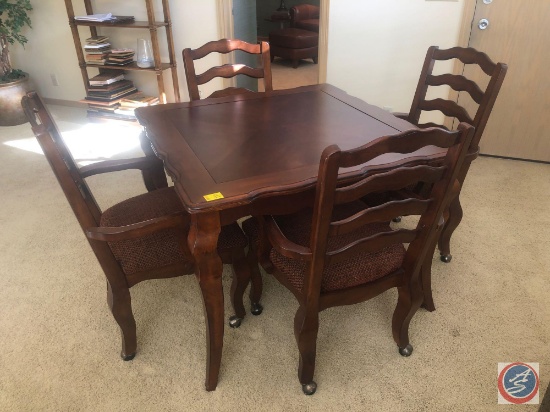 Dining Table Measuring 40" X 40" X 29.5" with (4) Rolling Chairs Made in Malaysia Measuring 39"