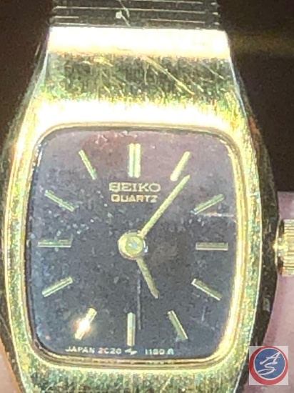 Seiko Gold Colored Watch with Base Metal Stainless Steel Back, Seiko Quartz  Watch with Black Band | Estate & Personal Property Personal Property |  Online Auctions | Proxibid