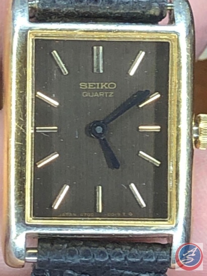 Seiko Gold Colored Watch with Base Metal Stainless Steel Back, Seiko Quartz  Watch with Black Band | Estate & Personal Property Personal Property |  Online Auctions | Proxibid
