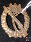 German WWII Army Bronze Infantry Assault Badge. The front shows a Mauser rifle in the center with a