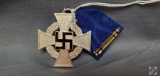 German WWII NSDAP 25 Year Faithful Service Cross. The front shows a swastika in the center of a