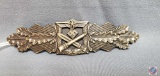 German WWII Army Bronze Close Combat Clasp. The front has a German eagle clutching a swastika in his